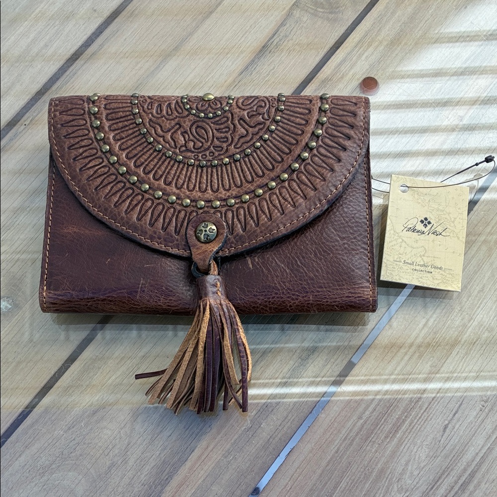 Patricia Nash New tags Brown Leather Clutch with Tassel.